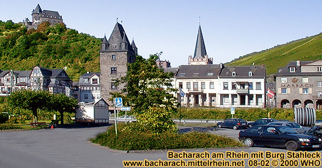 Bacharach on the Rhine River, large parking space on the Rhine River shore, next to the federal highway B9. Ca Stahleck, Marktturm and Peterskirche (Peter's church).